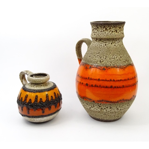 213 - Large Western Germany style pottery vase and a smaller Western Germany pottery vase, the larger 44cm... 