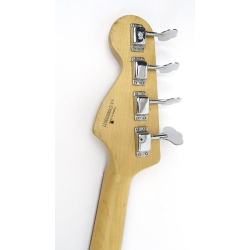 719 - Squire by Fender four string base guitar