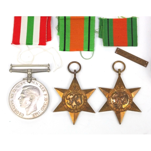 769 - Three Military interest World War II medals comprising the Italy Star, Africa Star and defence medal