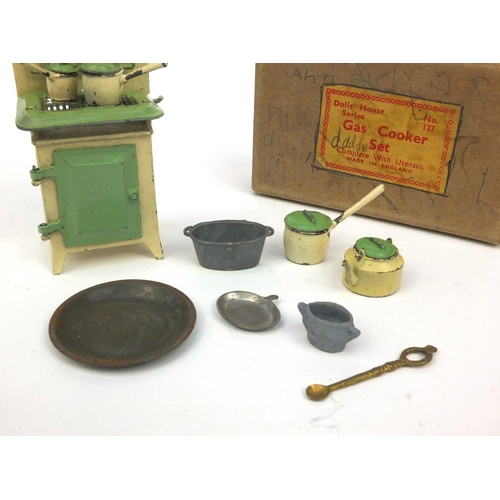 415 - Boxed cast iron dolls house gas cooker set with utensils, numbered 127, 10cm high