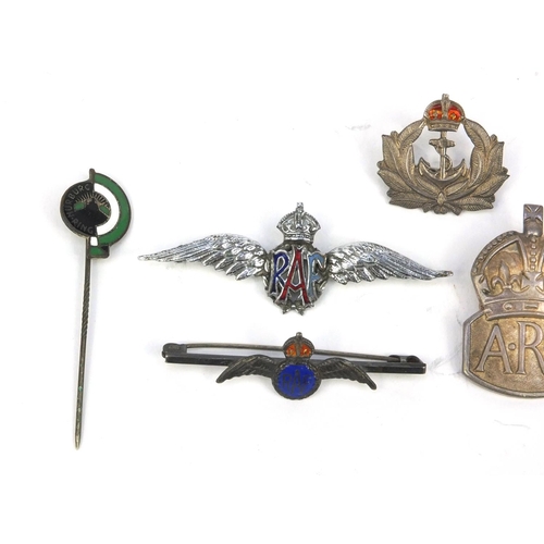 771 - Military interest badges including enamelled RAF example, silver ARP badge, miniature brass Spitfire... 