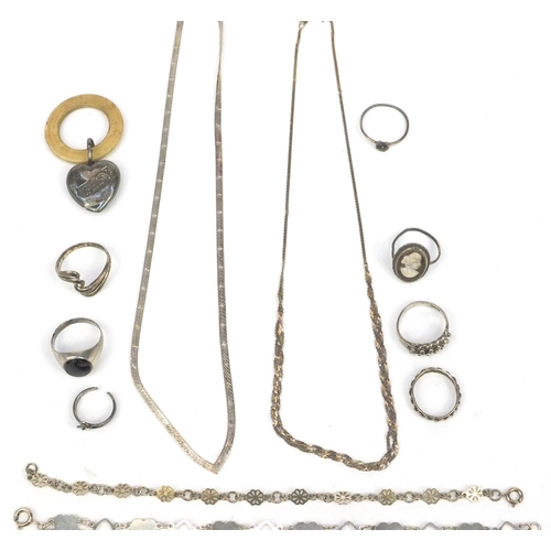 358 - Small selection of silver and white metal jewellery including necklaces and rings, and a silver baby... 