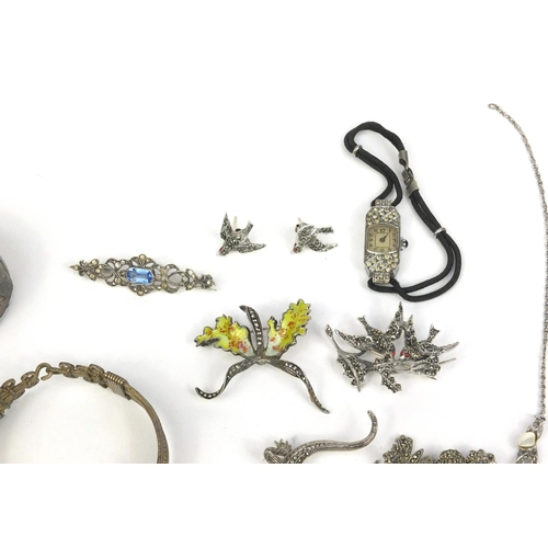 346 - Assorted jewellery including a Victorian silver bangle with floral chase decoration, marcasite brooc... 