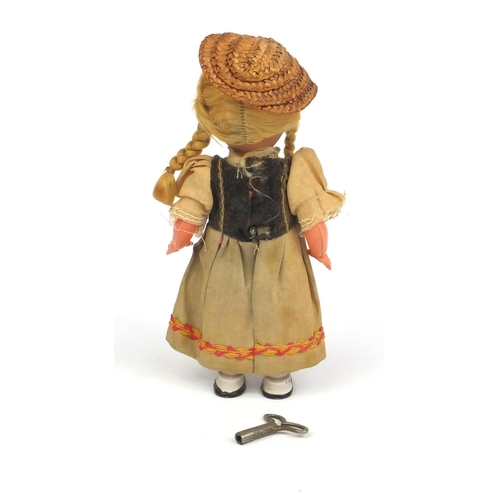 441 - Vintage clockwork dancing Dutch girl, 17cm high