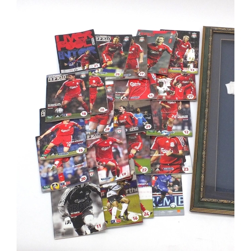 724 - Framed football interest Liverpool babies suit with a collection of Liverpool football programmes