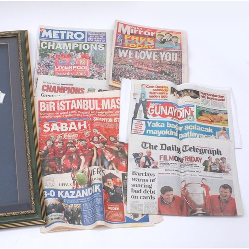 724 - Framed football interest Liverpool babies suit with a collection of Liverpool football programmes