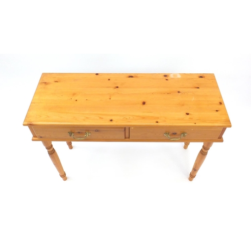 71 - Pine hall table fitted with two frieze drawers, 78cm high x 105cm wide x 39cm deep