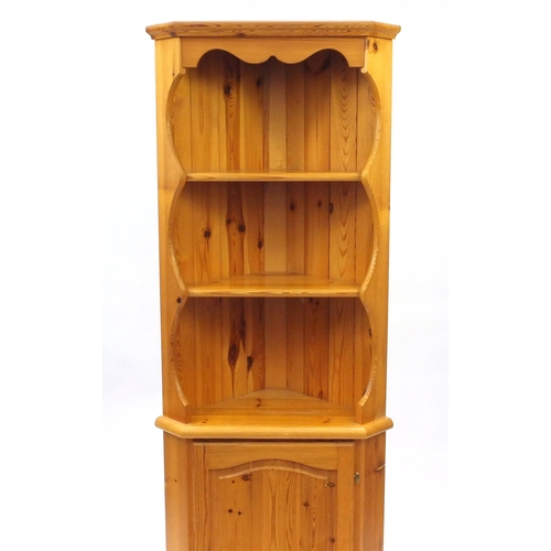 156 - Pine corner cupboard fitted with open shelves above a cupboard base, 178cm high