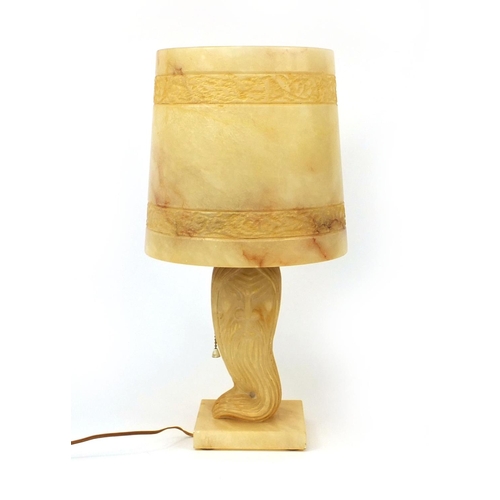 2094 - One piece carved alabaster table lamp, the column carved in the form of a bearded elder, 46cm high