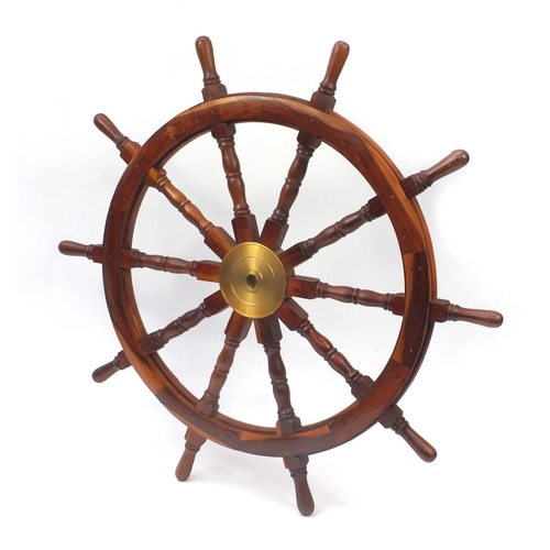2050 - Wooden ships wheel with brass centre, 122cm in diameter