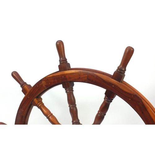 2050 - Wooden ships wheel with brass centre, 122cm in diameter