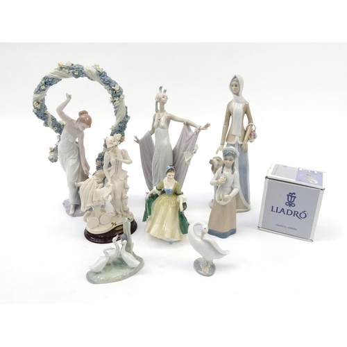 202 - Collectable figures and figurines including two large Lladro examples, the largest 40cm high