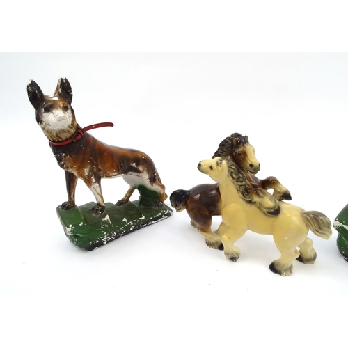 695 - Pair of Art Deco plaster dogs and a horse group, the dogs 42cm high