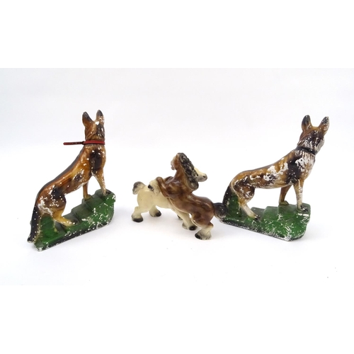 695 - Pair of Art Deco plaster dogs and a horse group, the dogs 42cm high