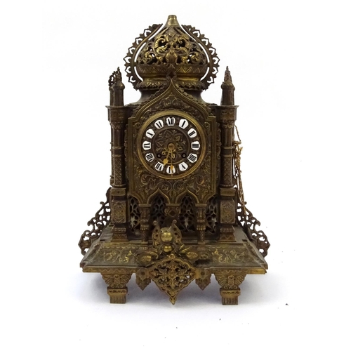 207 - Large ornate brass Cathedral style mantle clock with enamelled Roman numerals