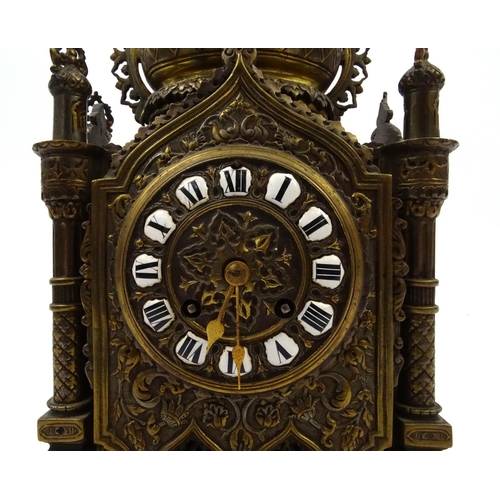 207 - Large ornate brass Cathedral style mantle clock with enamelled Roman numerals