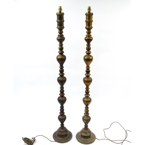 18 - Pair of Far Eastern brass turned standard lamps, 142cm high