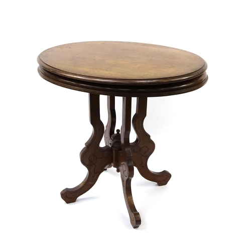 64 - Oval mahogany occasional table on shaped legs, 74cm high x 77cm wide x 60cm deep