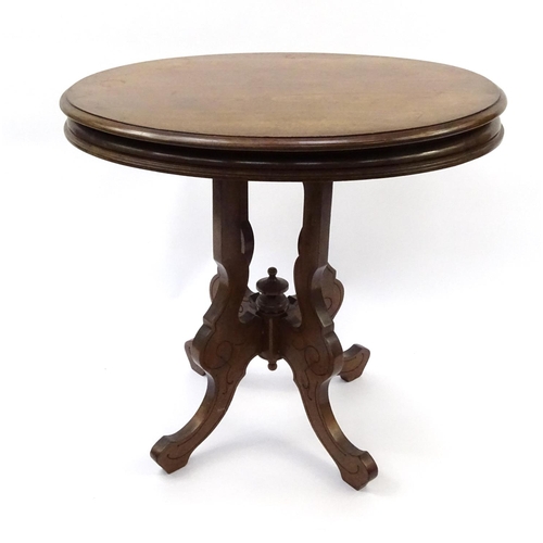 64 - Oval mahogany occasional table on shaped legs, 74cm high x 77cm wide x 60cm deep