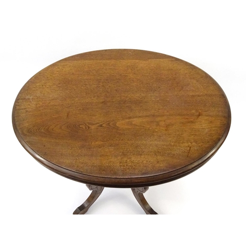 64 - Oval mahogany occasional table on shaped legs, 74cm high x 77cm wide x 60cm deep