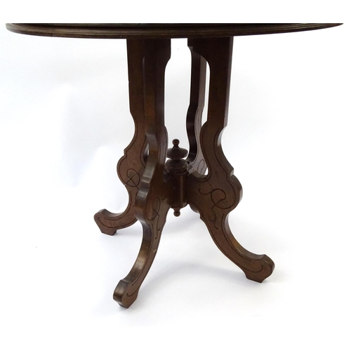 64 - Oval mahogany occasional table on shaped legs, 74cm high x 77cm wide x 60cm deep