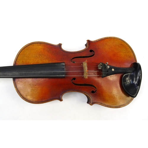 713 - Old violin and bow in a case