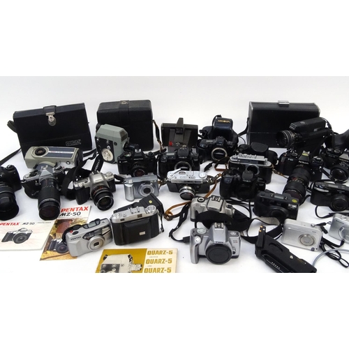 334 - Two boxes of assorted cameras lenses and accessories including Konica, Canon, Nikon and Zenit exampl... 