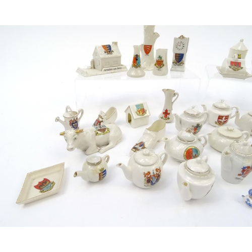 512 - Collection of crested china including a large selection of teapots