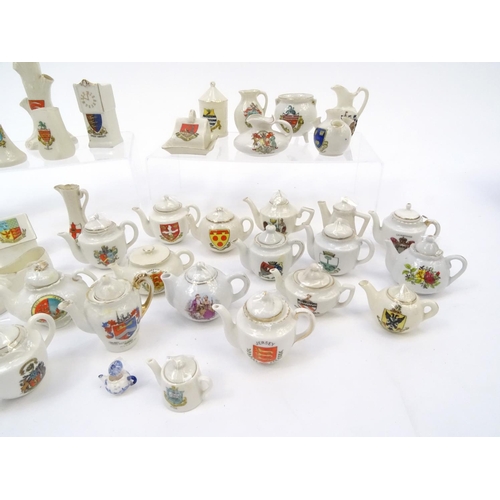 512 - Collection of crested china including a large selection of teapots