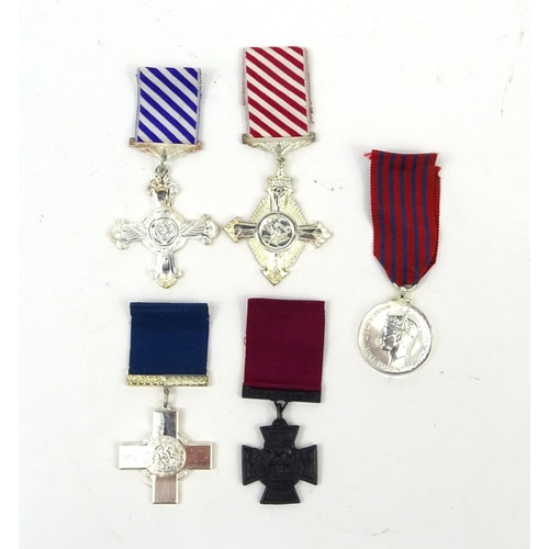 802 - Four Military interest copy medals including the distinguished flying cross