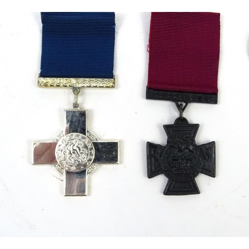 802 - Four Military interest copy medals including the distinguished flying cross