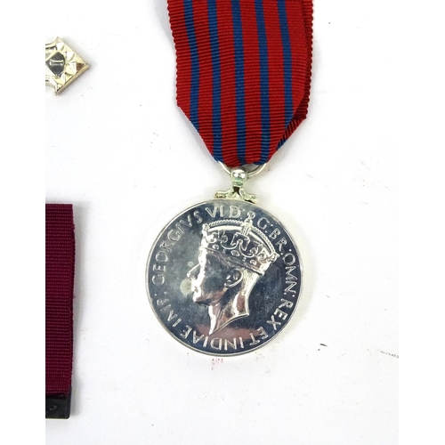 802 - Four Military interest copy medals including the distinguished flying cross