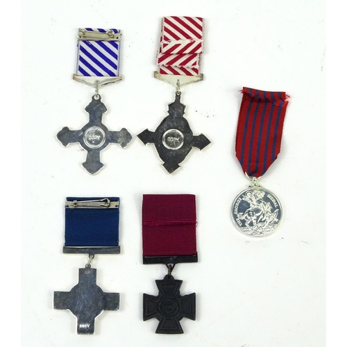 802 - Four Military interest copy medals including the distinguished flying cross