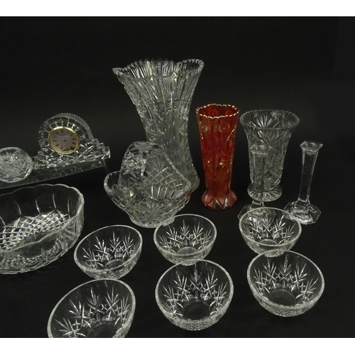 286 - Assorted cut glassware and crystal including a Waterford clock, vases, fruit bowls etc