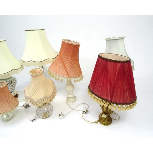 315 - Seven assorted table lamps with shades including glass, porcelain and marble examples