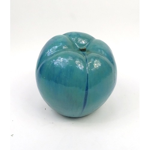 179 - Large turquoise glazed pottery apple, 38cm high