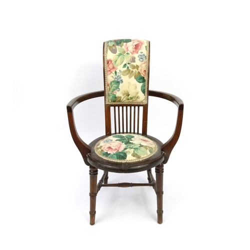 94 - Mahogany tub chair with floral upholstery, 82cm high