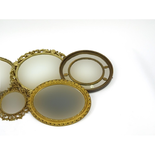 145 - Five circular gilt framed wall hanging mirrors, the largest 56cm in diameter