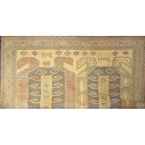 11 - Multi coloured geometric patterned rug, 300cm x 150cm