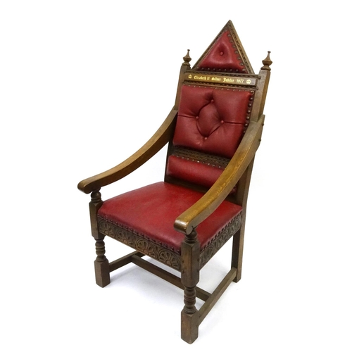 66 - Elizabeth II Silver Jubilee 1977 oak Throne with red leather button back upholstery, 140cm high