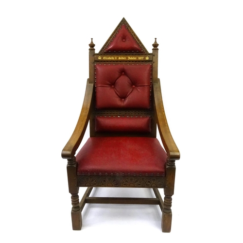 66 - Elizabeth II Silver Jubilee 1977 oak Throne with red leather button back upholstery, 140cm high