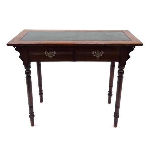 67 - Edwardian walnut writing table with tooled leather insert and two frieze drawers, 71cm high x 91cm w... 