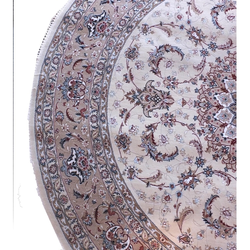 2025 - Circular Persian rug having all over floral motifs of a predominately beige ground with label to rev... 