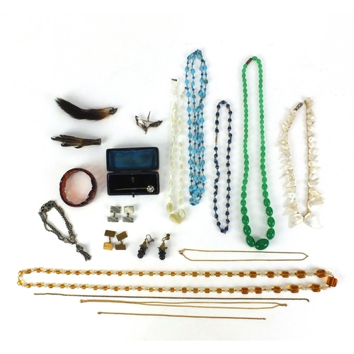 2542 - Assorted jewellery including a silver leaf brooch, glass bead necklaces, animal foot brooches etc