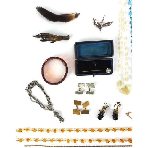 2542 - Assorted jewellery including a silver leaf brooch, glass bead necklaces, animal foot brooches etc