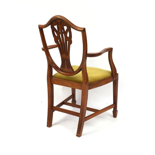 9 - Yew twin pedestal D-end dining and six dining chairs including two carvers, each carved with The Pri... 