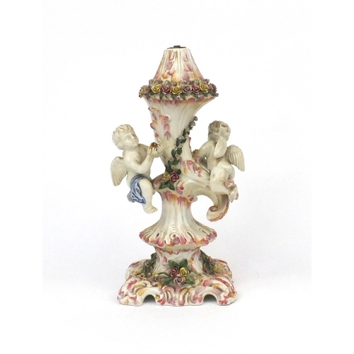 212 - Continental table lamp, decorated with two cherubs and flowers, lamp base 33cm high