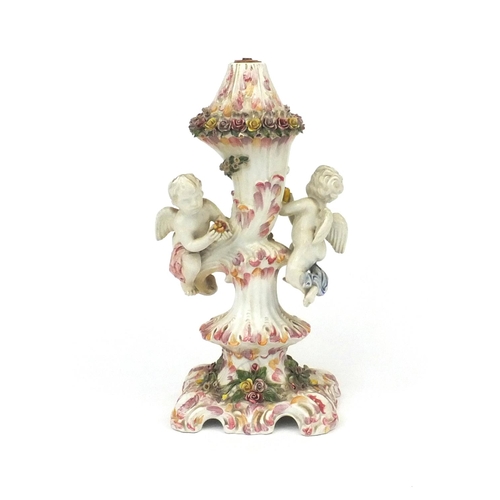 212 - Continental table lamp, decorated with two cherubs and flowers, lamp base 33cm high