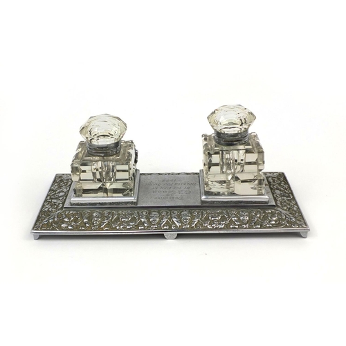 263 - Fire interest silver plated desk stand with two glass inkwells, presented to C R Couch by the men at... 