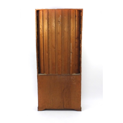 131 - Bleached wooden and painted cabinet with open shelves above a pair of panelled doors, 209cm high x 9... 